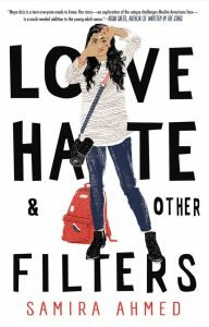love, hate & other filters by samira ahmed -- a brown girl in a striped shirt with her hair down makes a camera in front of her face with her hands; a camera bag is at her side with a red backpack behind her